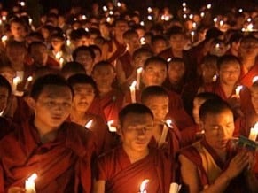 Candlelight vigil by Tibetan monks