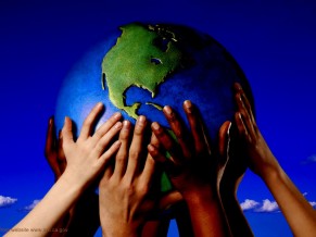 Volunteering - why we do it - hands holding the globe