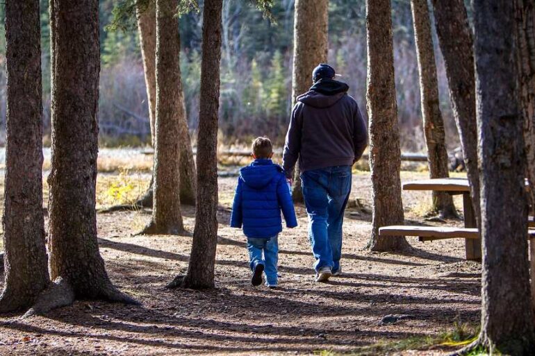 PARENTING WITH INTENTION: An introduction to intentional parenting by Rob Stringer 26 Father and young son walking outdoors
