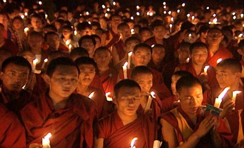 Candlelight vigil by Tibetan monks