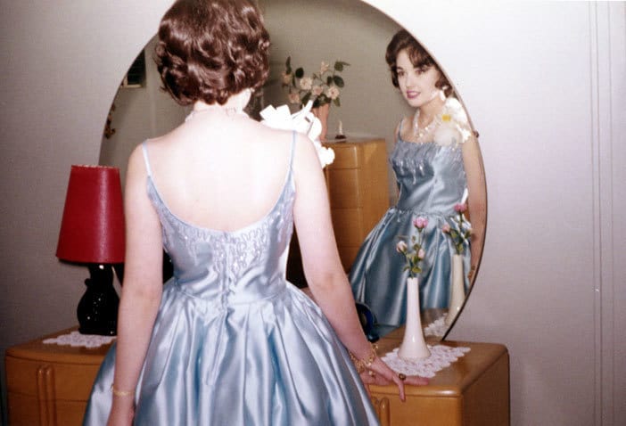 Woman looking in mirror