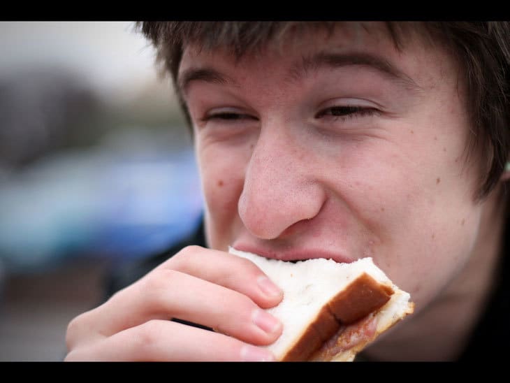 man eating sandwich