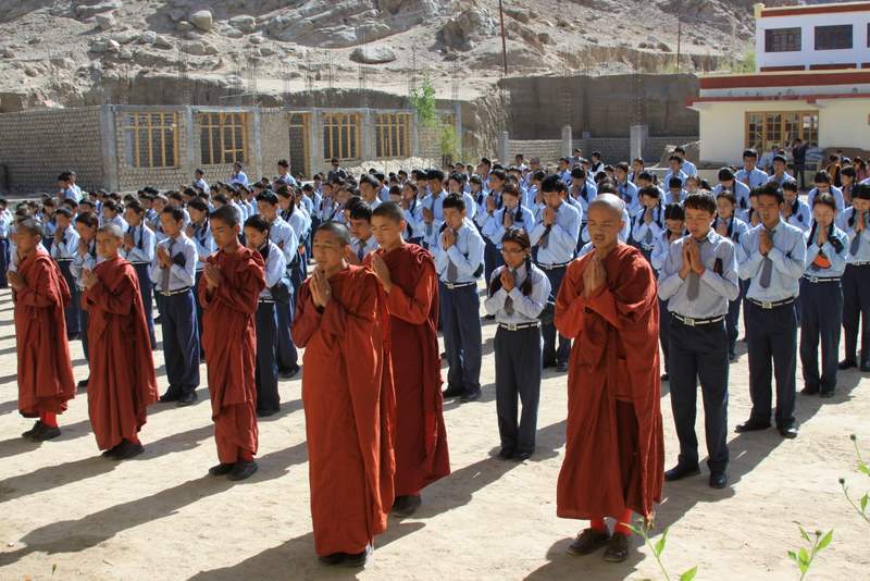 Spiritual Warriors - children and monks in courtyard