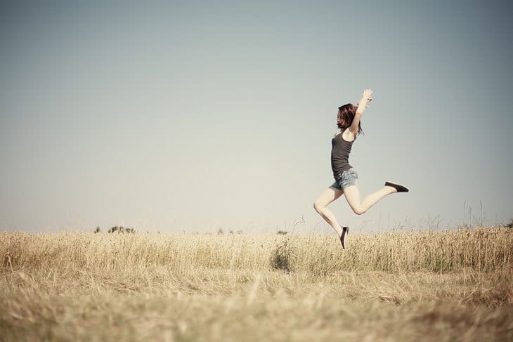 Dancer in field dancing alone