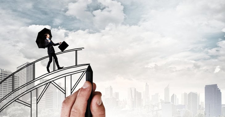 Man walking on bridge