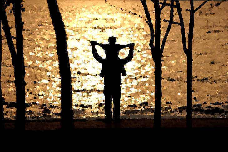 Man and boy overlooking water