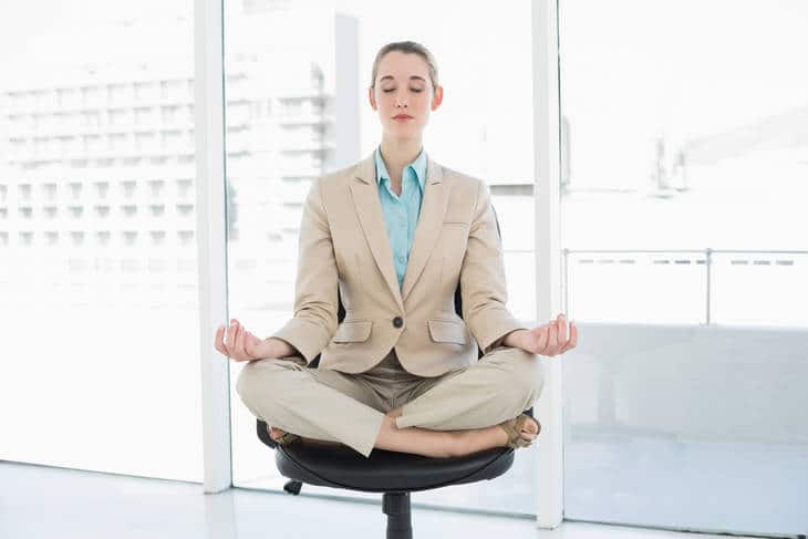JUST ONE BREATH: Week one of an eight-minute meditation program for beginners 17 Businesswoman meditating in chair - Just One Breath meditation