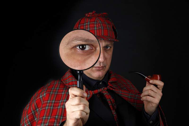 Sherlock Holmes with magnifying glass - free will, philosophy, existentialism, choice