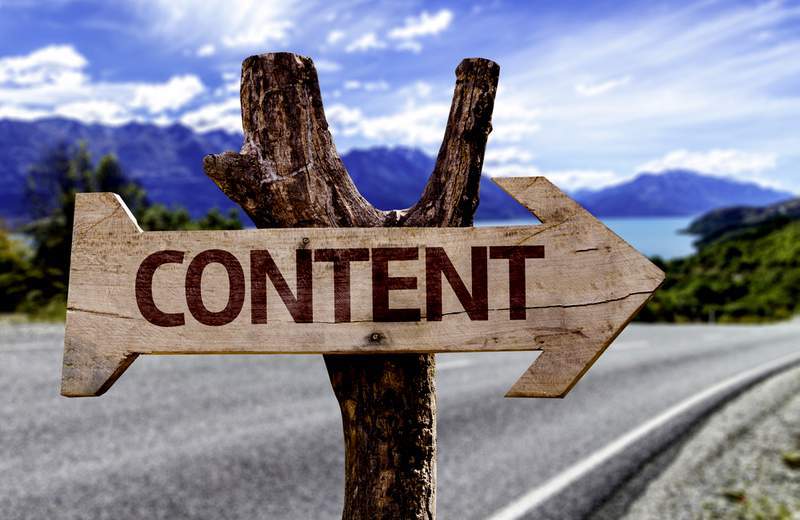 Content road sign on cleft stick