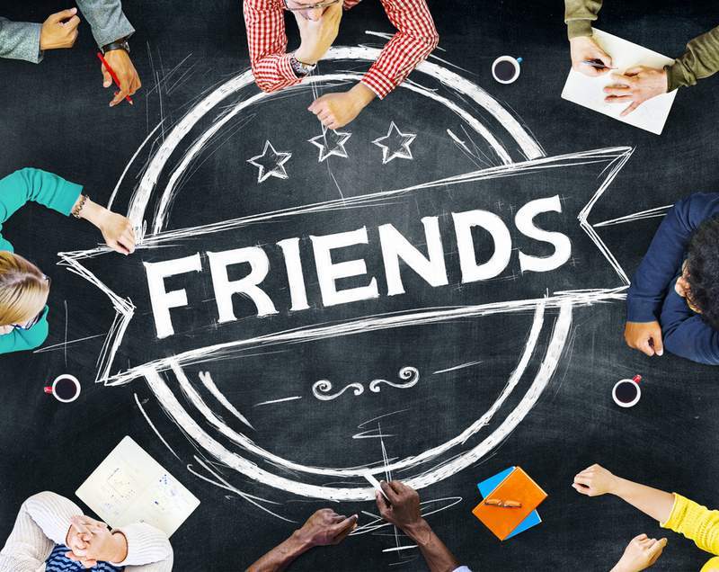 Chalk drawing with friends sitting around it