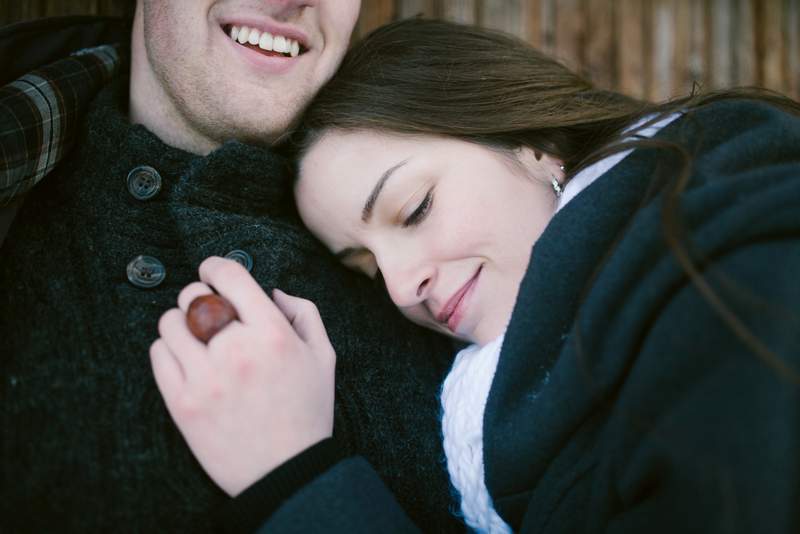 Young man holding young woman