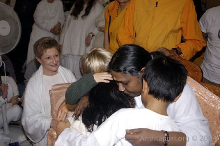 Amma hugging children