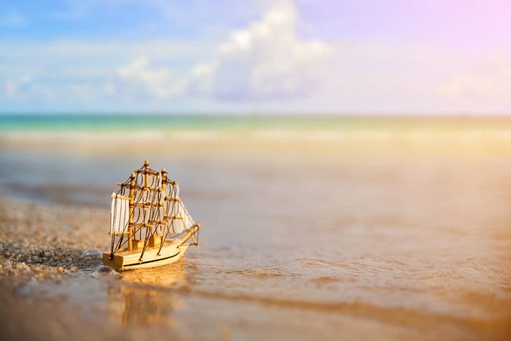 Model sailboat on ocean