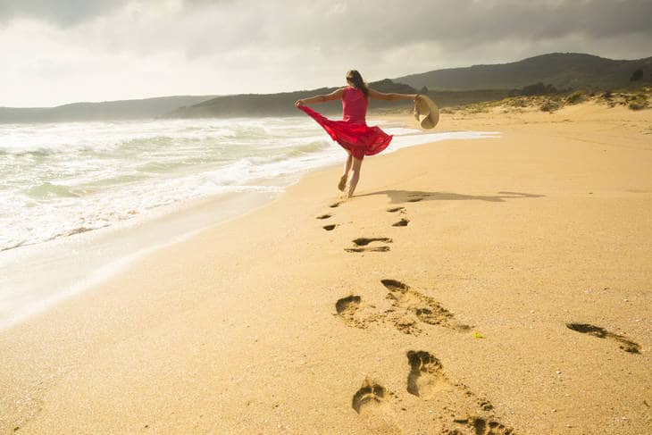 Woman running on beach - Father's daughters