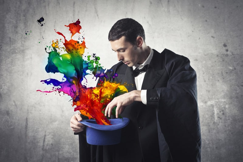 Magician pulling colours out of a hat