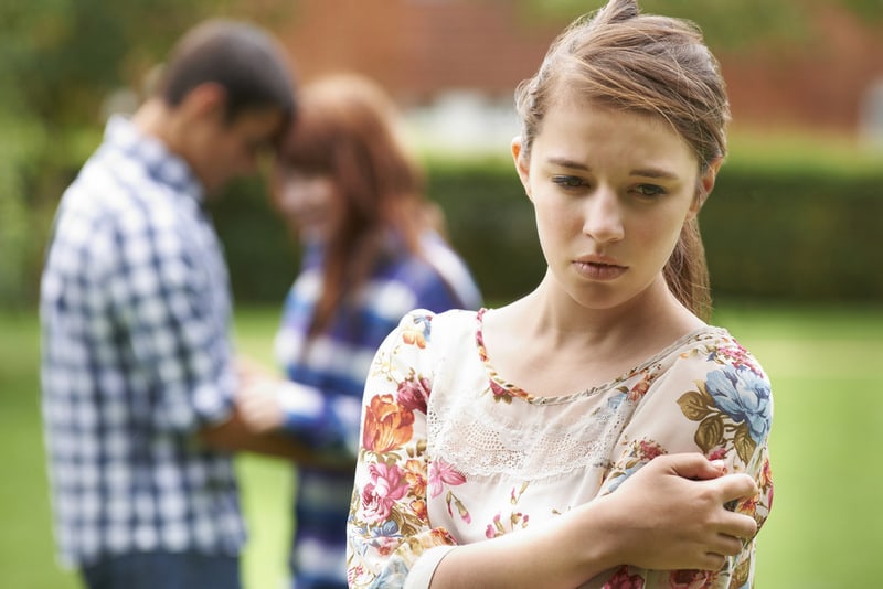 young girl being ignored by boyfriend