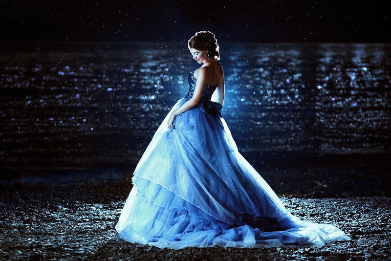 woman in a dark blue evening dress