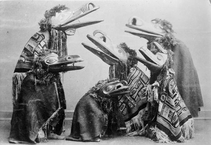 Native Americans in ceremonial masks, robes - Sacred totems