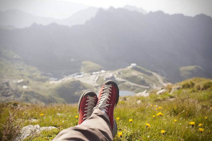 Traveller's feet while relaxing on mountaintop - Poems by Mike Larcombe