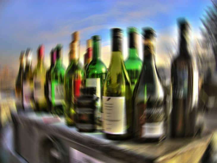 Blurry row of alcohol bottles - Thanking Anne Lamott