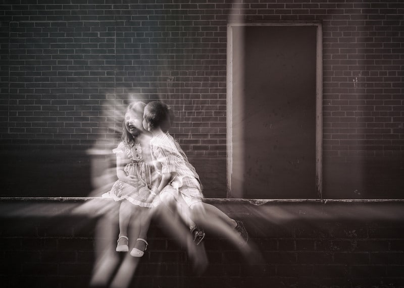 young boy and girl kissing