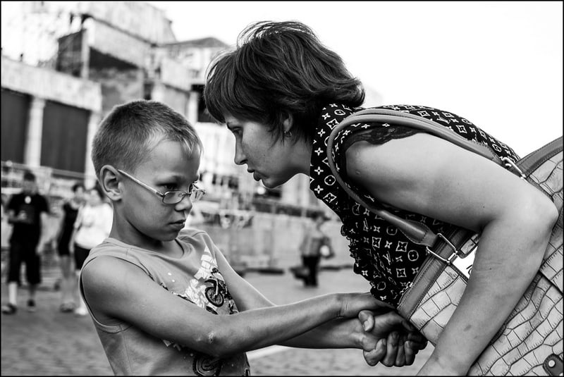Angry mother shouting at young son