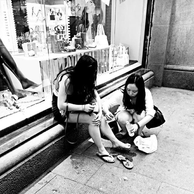 one girl looking at another's hurt knee