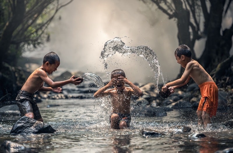 children splashing in water