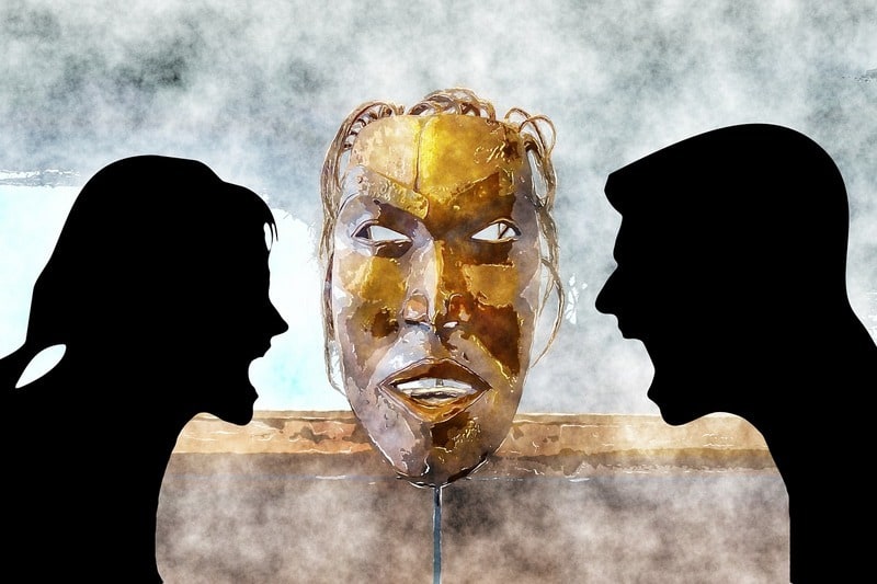 silhouette of two people shouting at each other