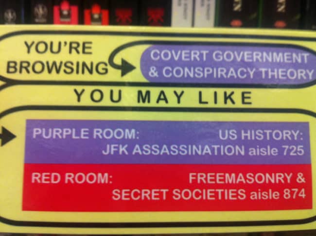 Conspiracy theory department sign at library - Fact vs. fiction