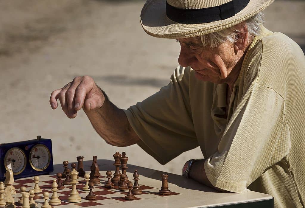 THE LESSON OF NOW: Alzheimer’s and making peace with new limitations 13 old man playing chess in a park