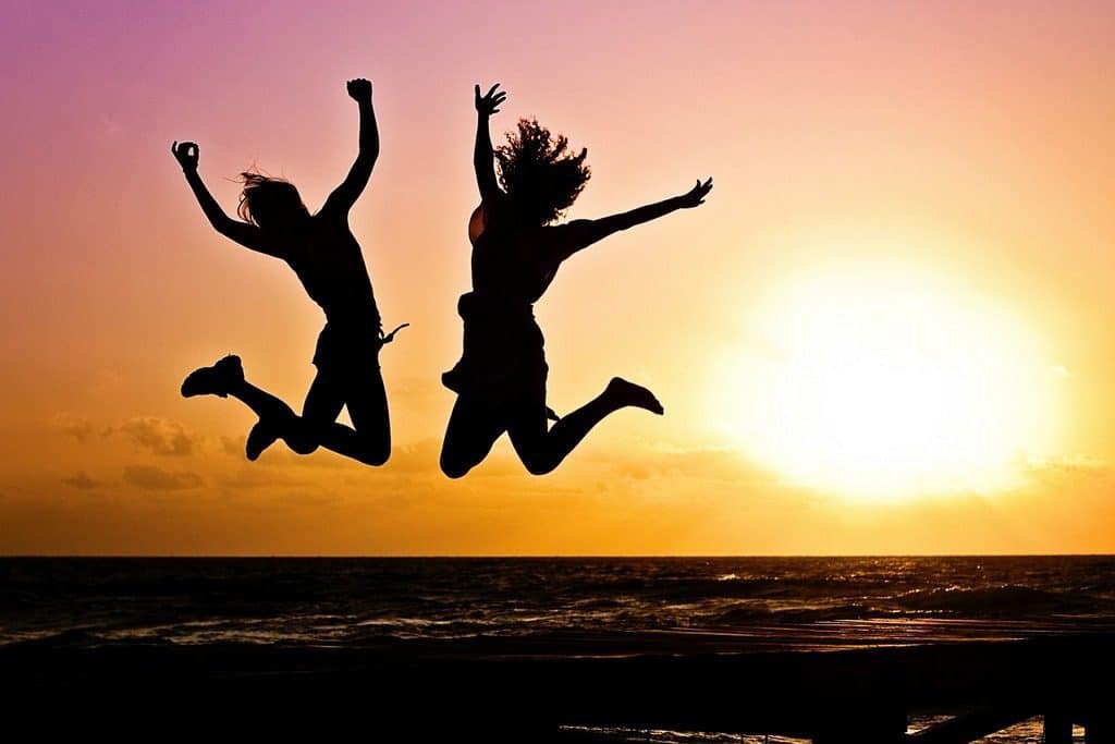 happy silhouettes jumping
