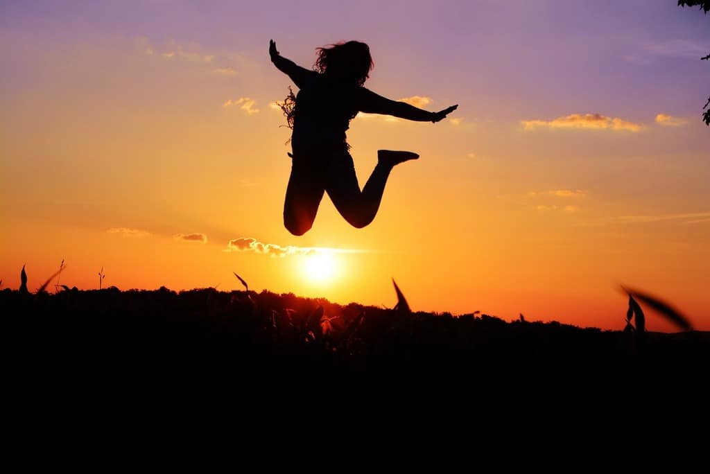 silhouette of woman jumping