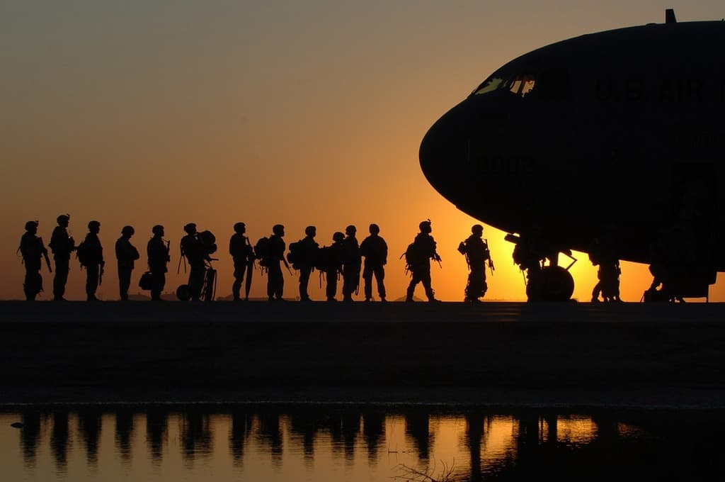 Soldiers boarding a plane for Iraq