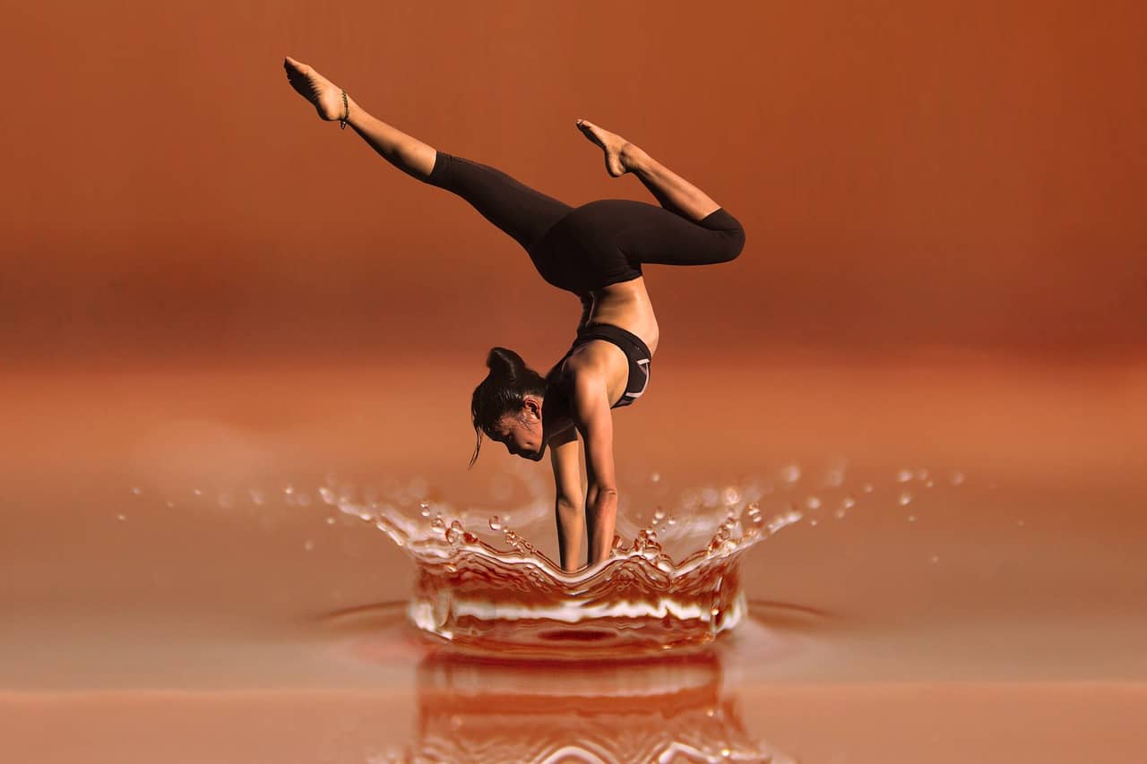 DANCE FOR JOY: Use this 3-step dancing exercise to connect with your spiritual side 13 Woman performing Yoga-inspired dance while diving into water - Conscious dance