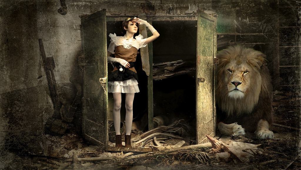 woman at door next to a lion