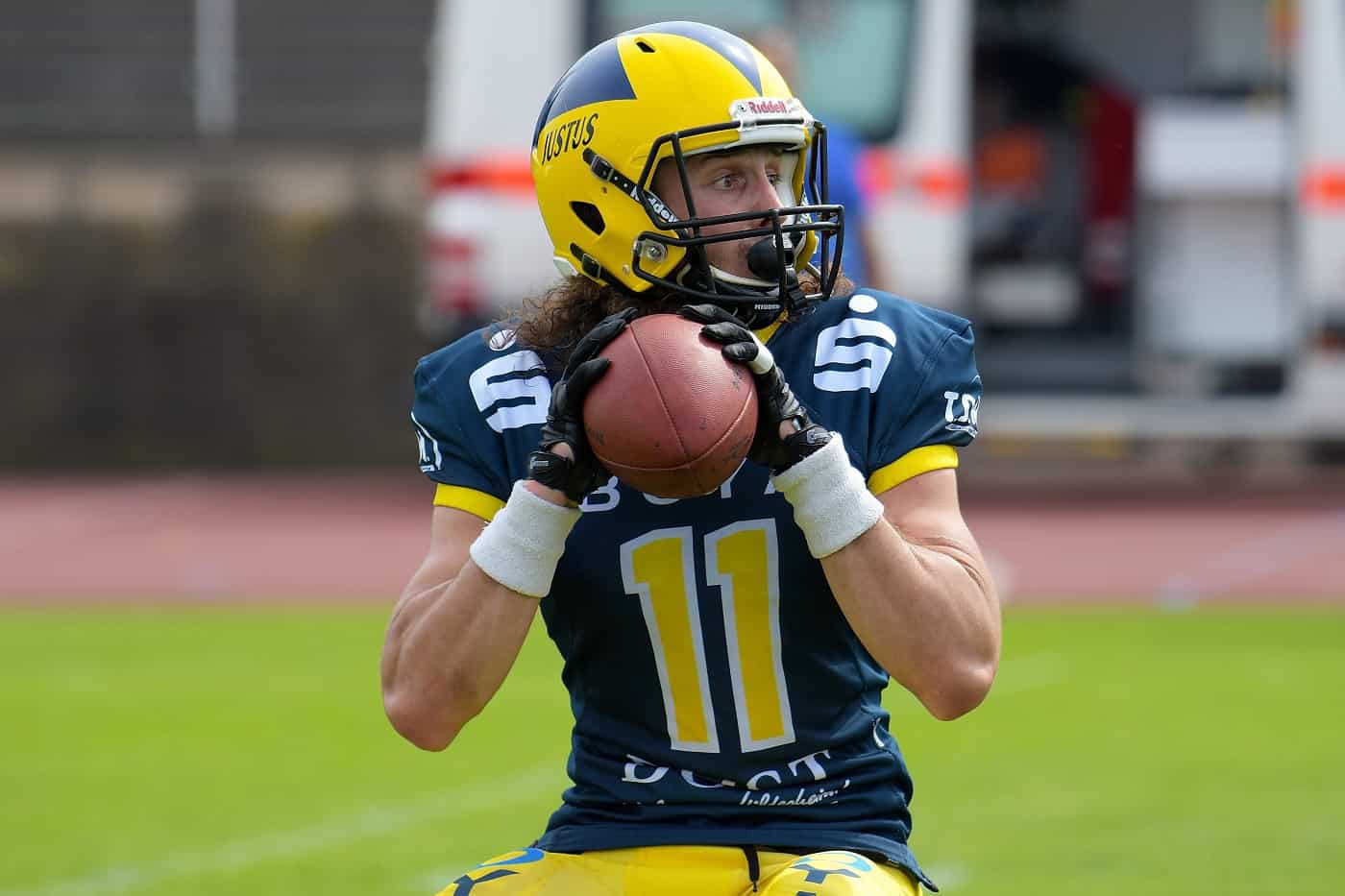 Lone football player getting ready to throw - The import