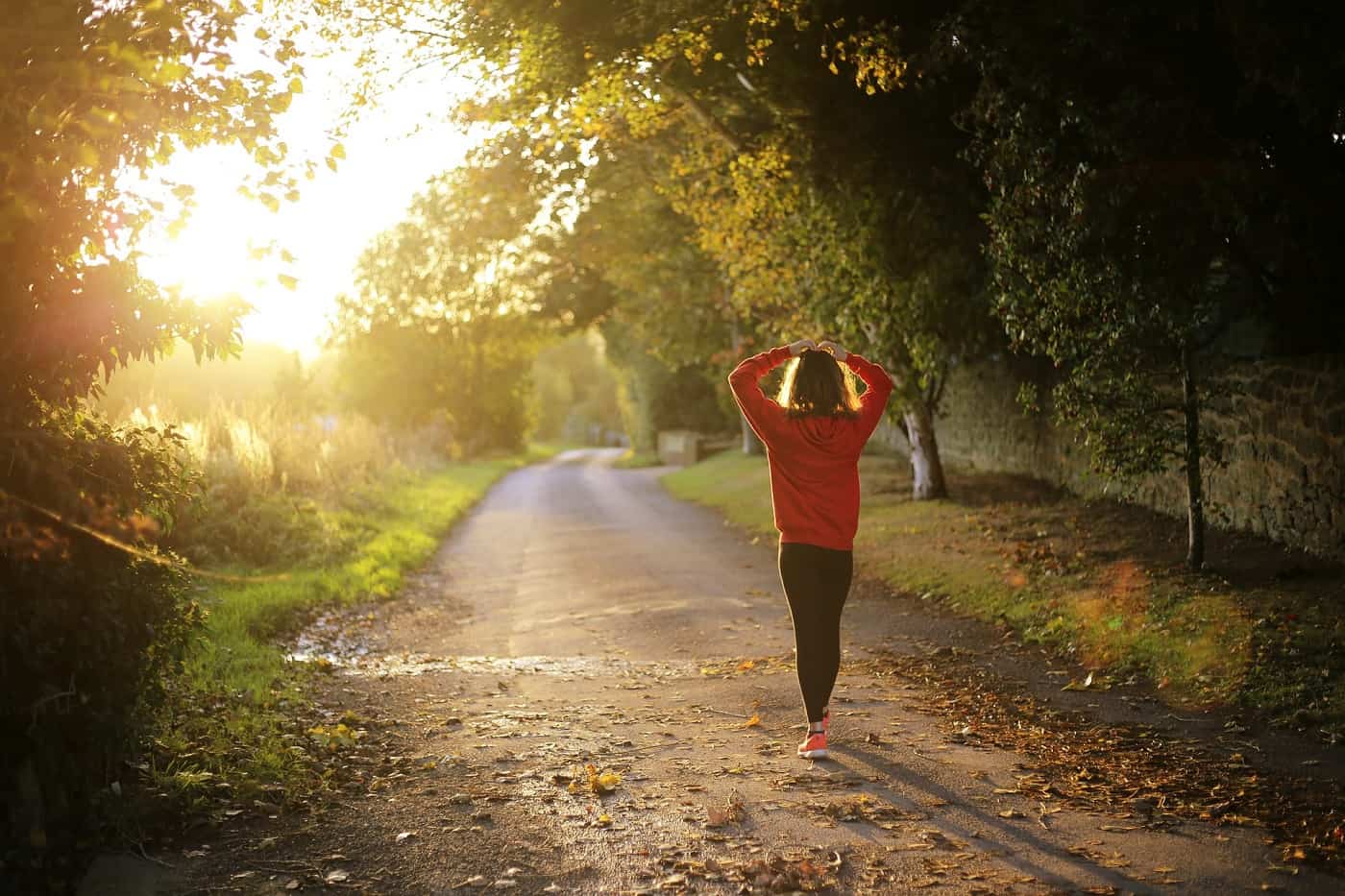 Girl walking on path in sun - Your fittest future self