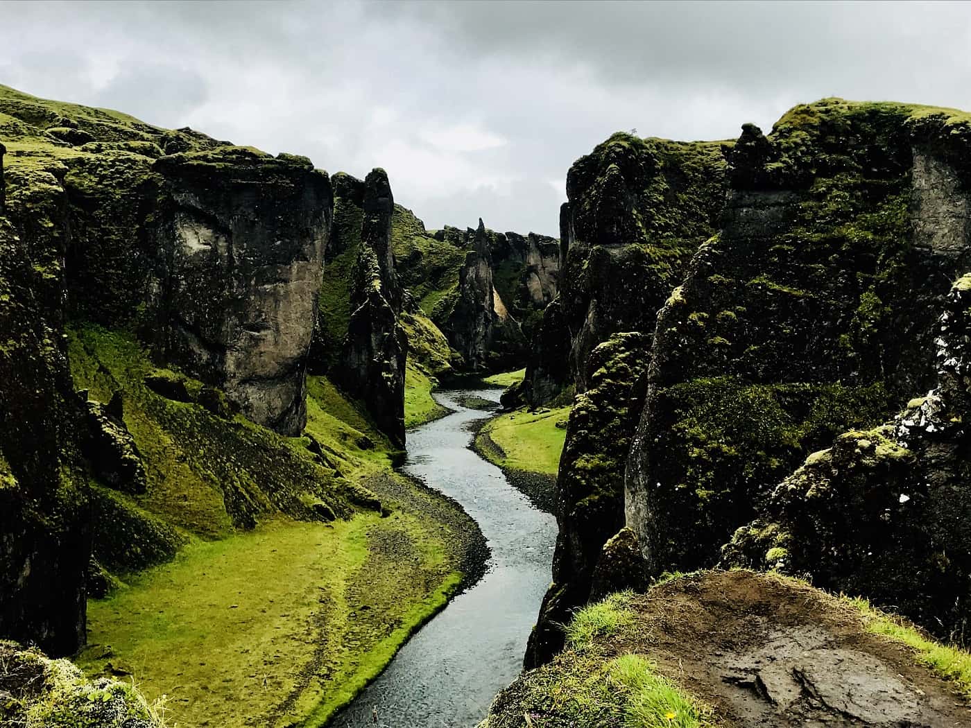 Cliffs with water running between them in Iceland - Poems by Alice Shi Kembel