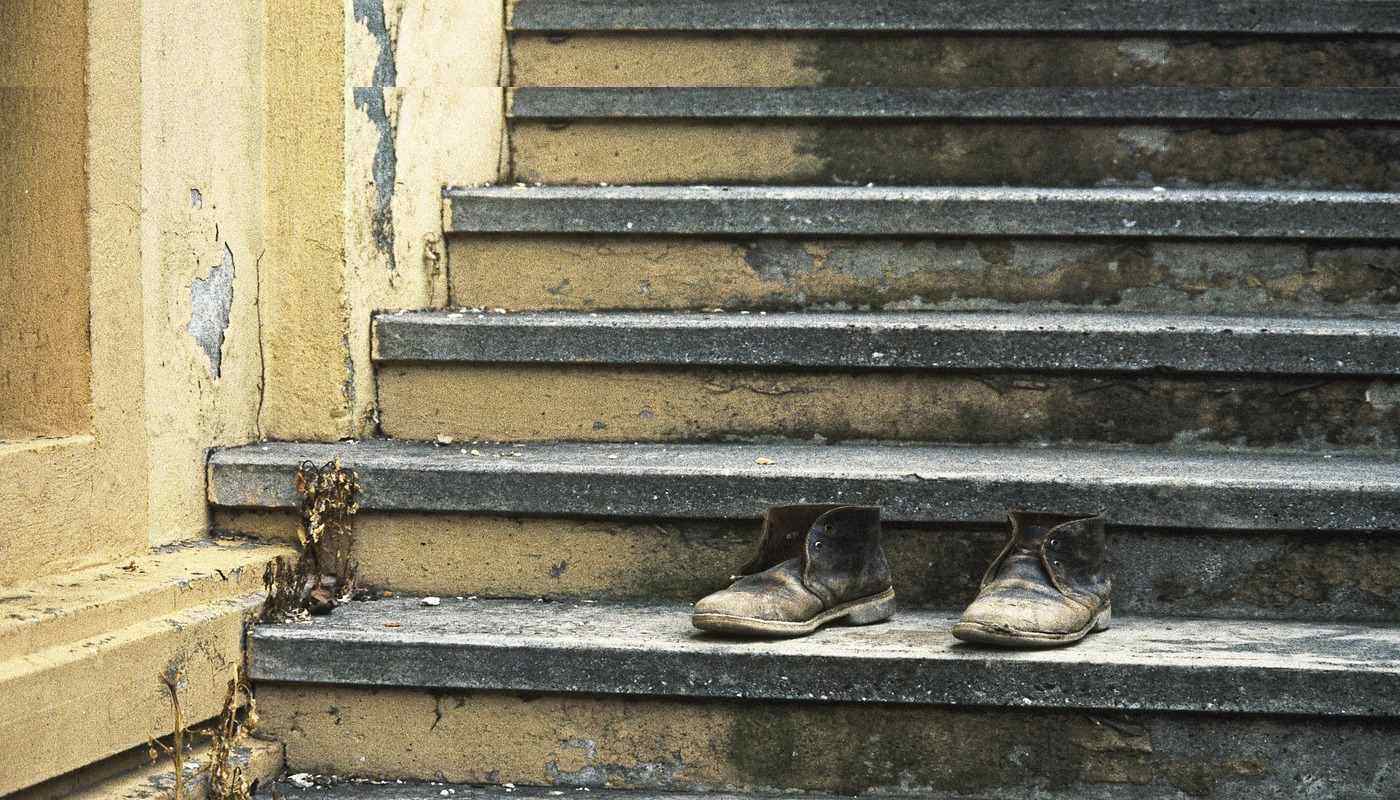 pair of old shoes on steps