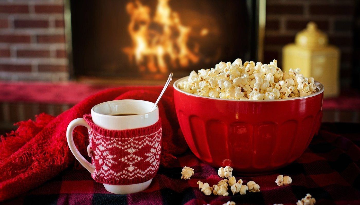 cup of hot chocolate, popcorn and fire