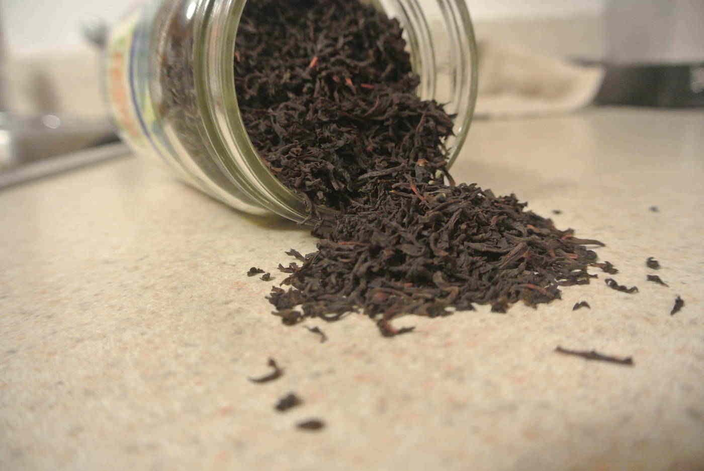 Black tea spilling out of a jar