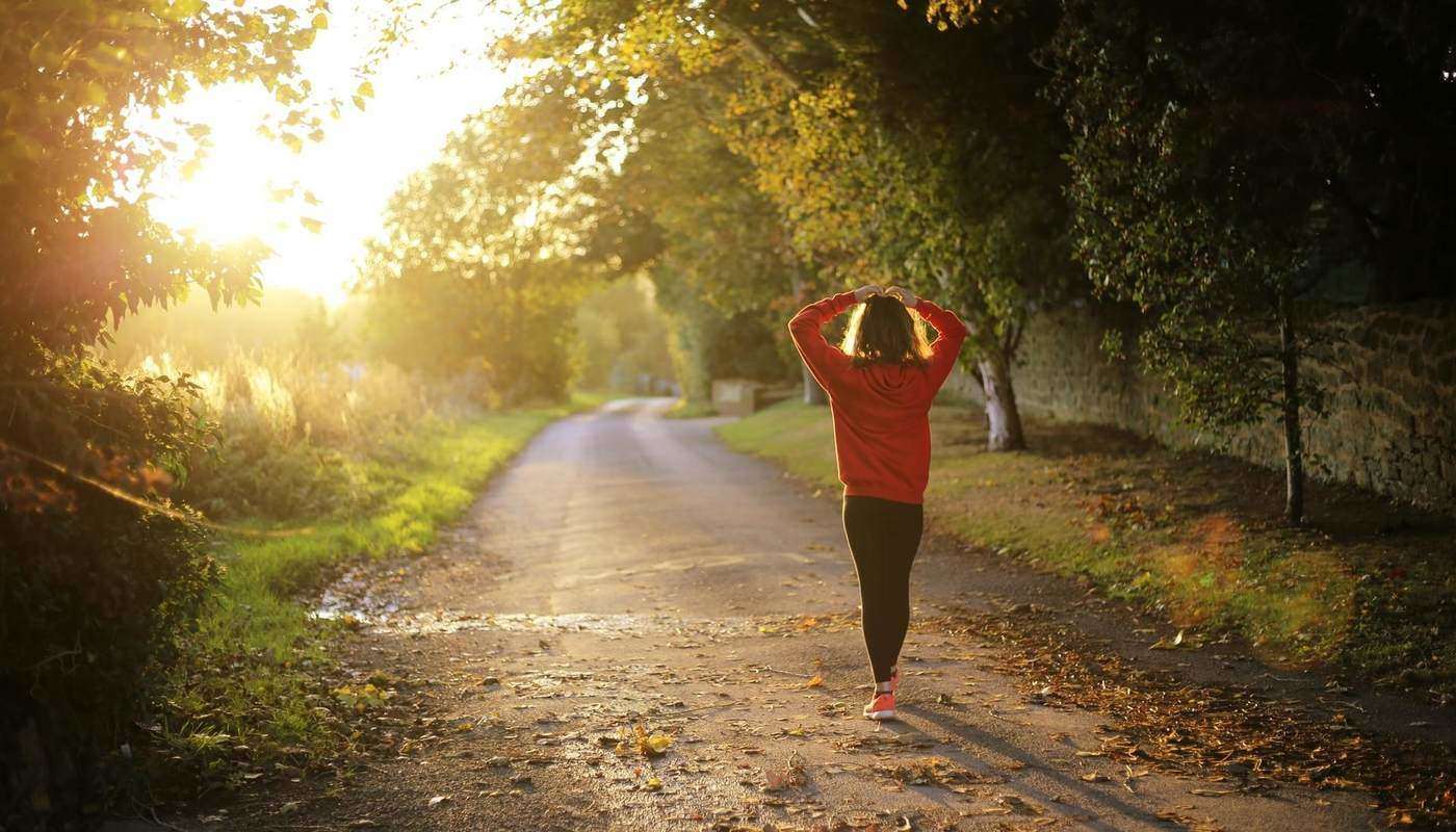 woman walking on country road