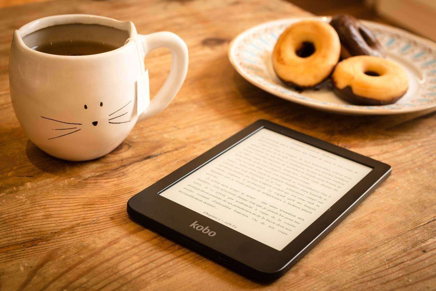 E-reader with coffee and donuts