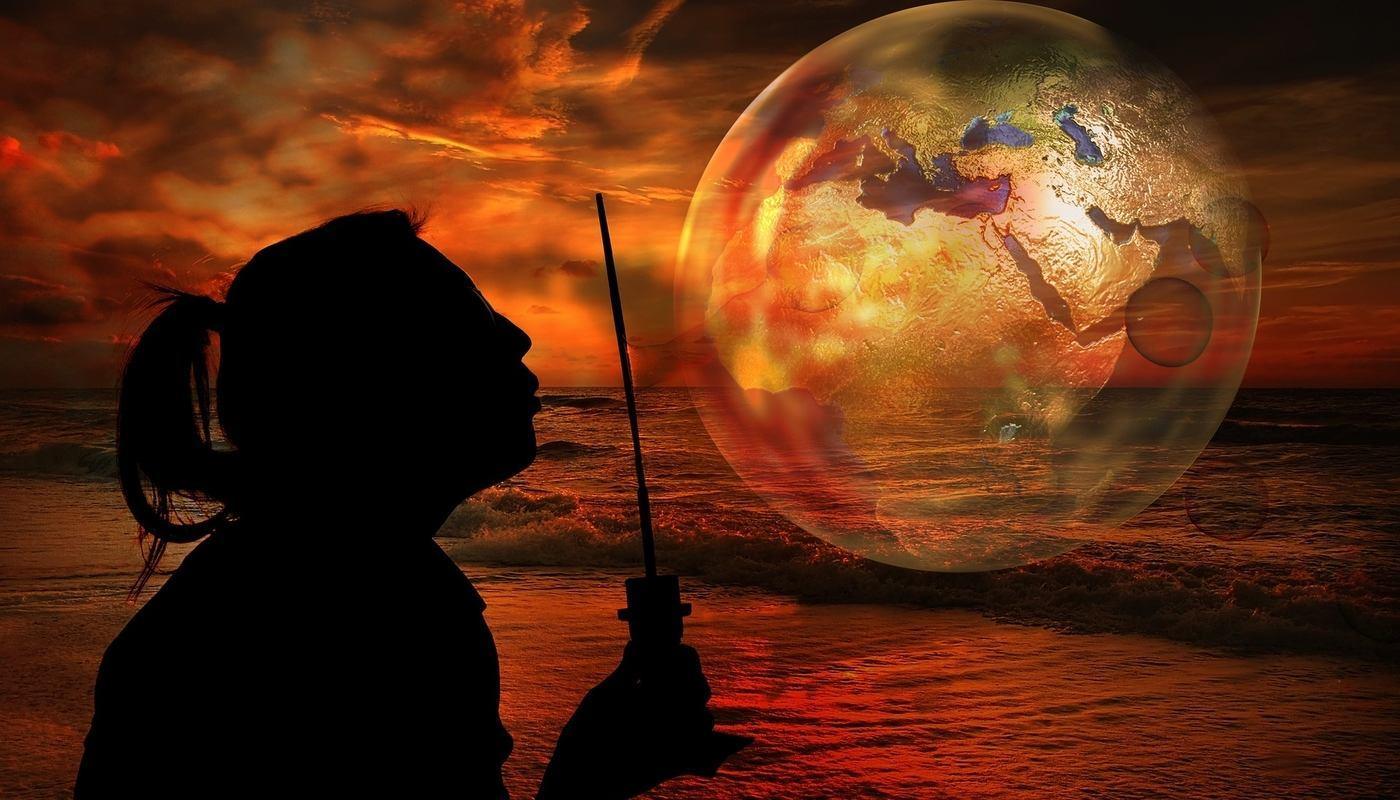 woman blowing a bubble of earth