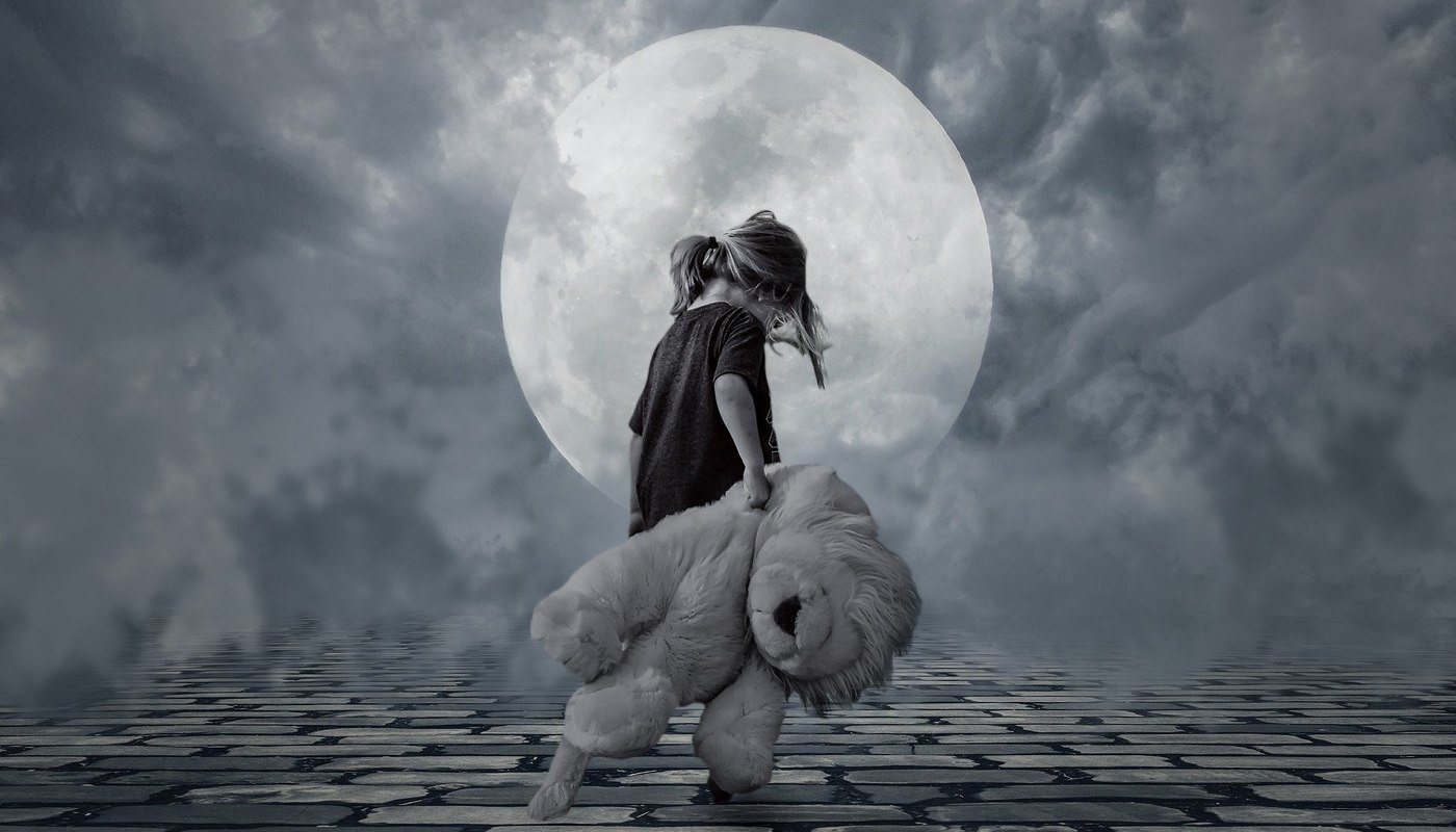 little girl dragging teddy bear