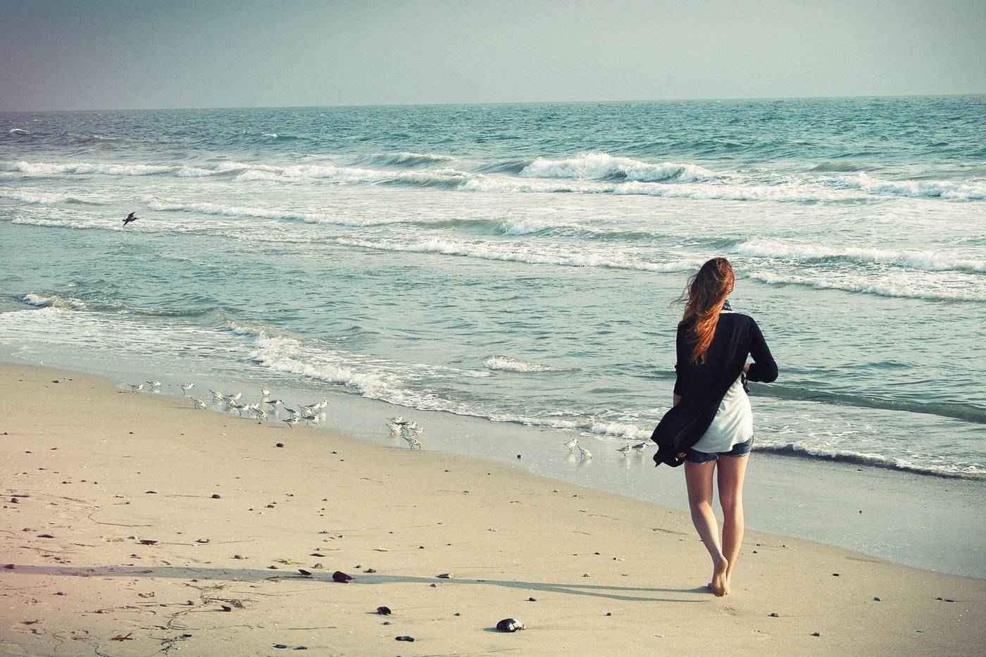 Woman walking on beach