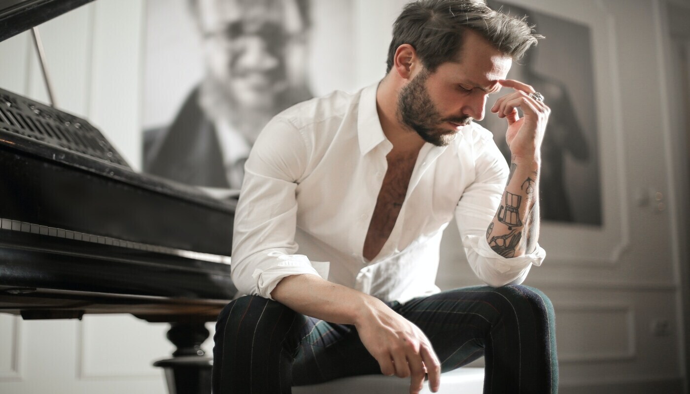 pianist at piano taking in the 'feeling' around him
