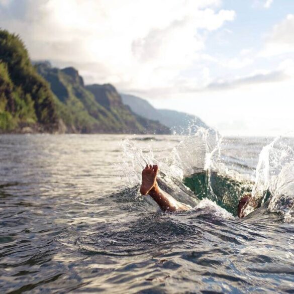 person splashing in ocean