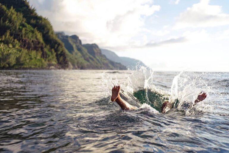 person splashing in ocean
